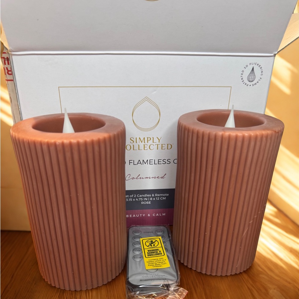A set of 2 Simply Collected Luxury 3D Flameless Candles with a remote